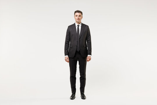 Full length young happy caucasian successful employee business corporate lawyer man 20s wearing classic formal black grey suit shirt tie work in office isolated on white background studio portrait