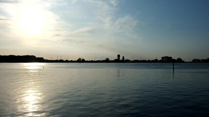 Chioggia, Venice, Italy: night landscape of the bay with two boats that cross
