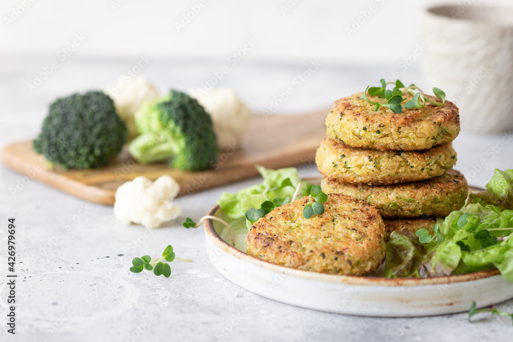 Wall mural veggie burgers with quinoa, broccoli, cauliflower served with salad. plant based food. space for tex