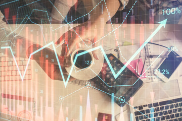 Double exposure of man and woman working together and financial chart hologram drawing. market analysis concept. Computer background. Top View.