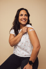 Fototapeta premium Proud woman with vaccination