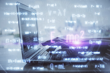 Double exposure of woman hands typing on computer and formula hologram drawing. Education concept.