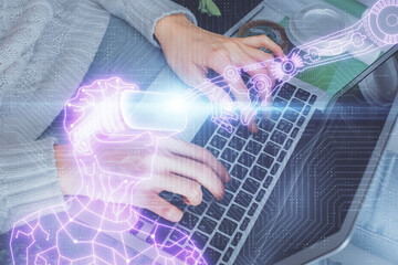 Fototapeta premium Double exposure of woman hands typing on computer and man in AR glasses drawing. Education concept.