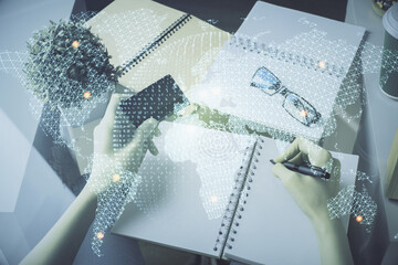 Multi exposure of woman on-line shopping holding a credit card and financial theme drawing. Business E-commerce concept.