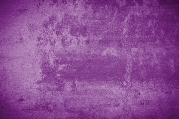 Closeup of purple textured grunge background. Dark wall edges