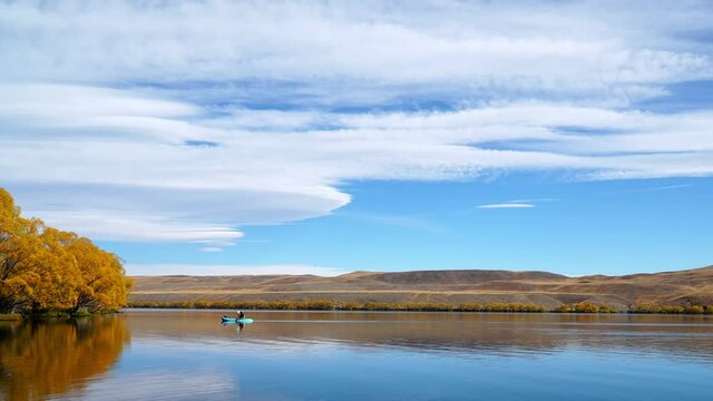 time lapse of Lake Alexandrina in autumn with cirrus clouds in the blue sky