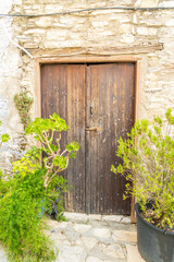 Fototapeta na wymiar November 2020. Kato Drys in Larnaca District, Cyprus. Wooden door in The traditional village of Kato Drys in Cyprus