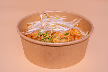 Eating diet concept. Buddha Poke Bowl Of Bean Sprouts, Shrimp, Rice, Dry Onion. Lunch break. Close up, copy space, top view. Isolated on pink background