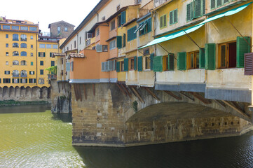 Fototapeta na wymiar Ponte Vecchio view with Arno river in the City of Florence, Italy