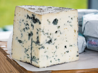  Assorted organic artisan made Stilton cheese on sale at a farmers market