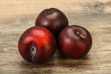 Ripe sweet plum fruit heap