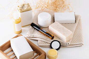 Means for body and face care, homemade cosmetics from natural ingredients, soap, cream, oil, on a white background