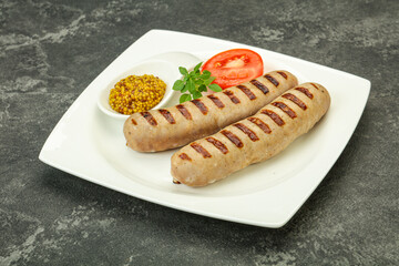 Grilled natural pork sausages with sauce