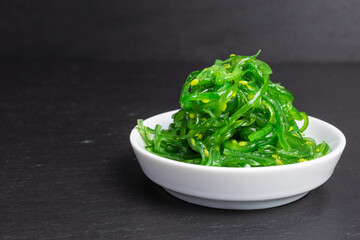 fresh green wakame seaweed salad - 426989820