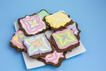 assortment of cookies with pastel colored frosting