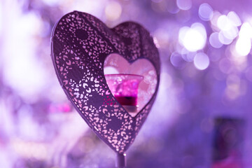 Obraz premium Dreamy close up image of a latticed heart indicating love and happiness with strong bokeh.