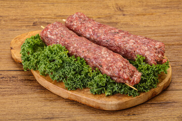 Raw minced beef kebab skewer