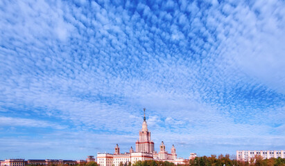 Panoramic view of sunny sunset campus of famous university in Moscow with cloudy blue sky