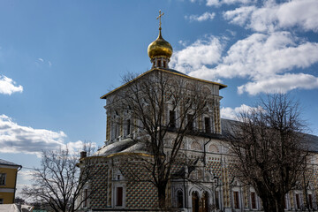 golden towers and ancient architectural solutions of the Trinity-Sergievskaya Lavra in Sergiev Posad on a sunny spring day