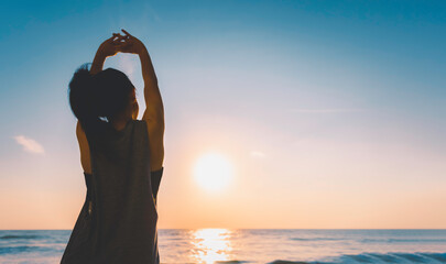 Summer vacations freedom concept, Silhouette Healthy sporty female stretch arm doing exercise on...