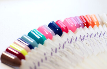 Manicure color options gel polish on a special palette in the beauty salon. Space for the text. Close-up