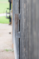 Wooden handle on a barn door vertical