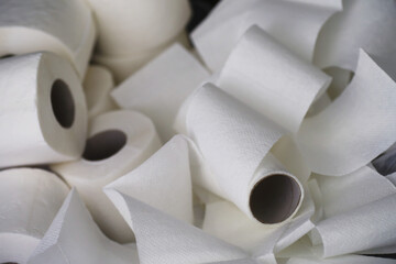 Toilet paper in a roll. Snow-white soft three-layer toilet paper. Lack of hygiene products. Primary protection and disinfection.