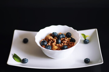 A healthy breakfast cereal with milk and fruit. Oat and corn flakes with chocolate and yogurt. The concept of healthy and vegetarian food.