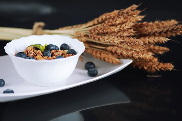 A healthy breakfast cereal with milk and fruit. Oat and corn flakes with chocolate and yogurt. The concept of healthy and vegetarian food.