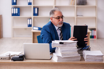 Old male employee and too much work in the office