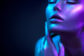 Glowing skin with sequins. Fashion model woman in colorful bright sparkles and neon lights posing...
