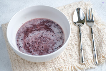 Bubur Ketan Hitam or black glutinous rice porridge with coconut milk sauce