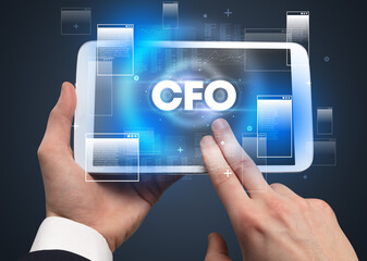 Close-up of a hand holding tablet