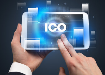 Close-up of a hand holding tablet