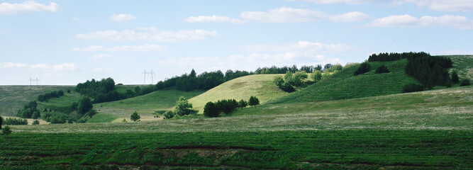 Trees on the small mountains and electrical line (high voltage)