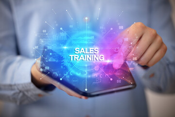 Businessman holding a foldable smartphone, new business concept