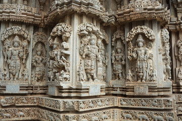 Fototapeta na wymiar A Detail Stone sculpture of Indian deities on a temple exterior , India is blessed with thousands of magnificent stone temples and is a great tourist attraction.