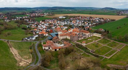 Fototapeta na wymiar Aerial view of the village and monastery Johannesberg in Germany, Hesse on an early spring 