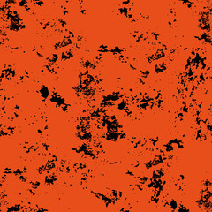 A seamless pattern of a chaotic dark pattern on an orange background.A ragged structure. Textiles or packaging.