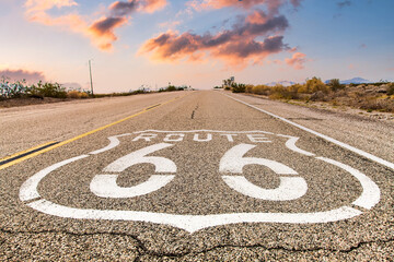 Route 66 road sign with blue sky background. Classic concept for travel and adventure in a vintage way.