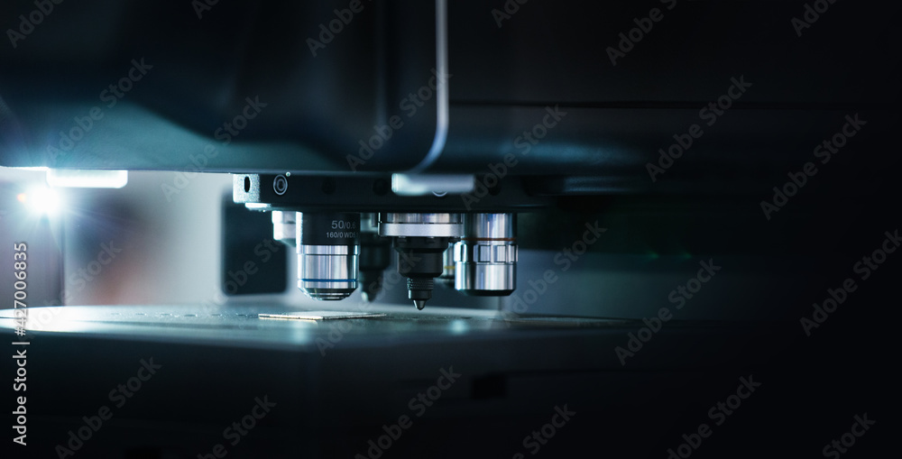 Poster microscope in laboratory. optic machine for precise measurement of part size and quality evaluation.