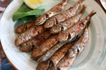 Fried red mullet on plate