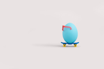 Creative minimal Easter concept with blue egg riding skateboard