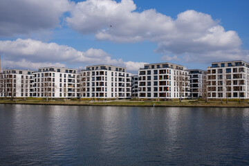 New residential buildings on the riverside of the Spree in Berlin. Recently developed residential...