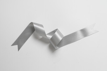 A roll silver color ribbon isolated on white