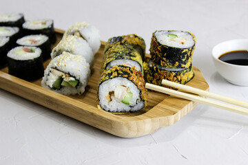 Fried rolls, classic on a wooden tray.