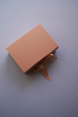 Fototapeta premium Woman hands open empty cardboard box, top view
