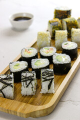 Fried rolls, classic on a wooden tray.