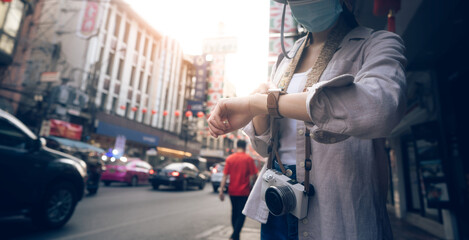 Fototapeta premium Close up hand woman people wear smart watch checking time and health information at outdoor.