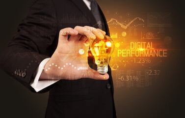 Businessman holding a lightbulb concept